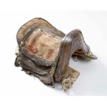 Chinese SaddleChinese saddle, wood with remains of textile leather and strings decorated with iron