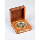 Earl court compassEarl court compass, with windrose in polished brass frame glazed in wooden