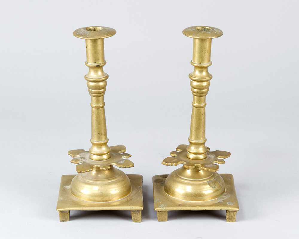 Pair of candle sticksPair of candle sticks, brass casted in three parts on quadratic base with