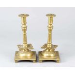 Pair of candle sticksPair of candle sticks, brass casted in three parts on quadratic base with