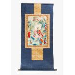 ThangkaThangka, multi colloured fine embroidery in textile frame on blue textile, with red textile