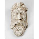 Grotesque Stone MaskGrotesque stone mask, of a bearded man with open mouth and large ears masterly