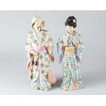 Pair of shaking PagodasPair of shaking Porcelain Pagodas, male and female in Asian style and dress