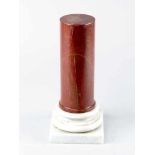 Marble ColumnMarble column, cylinder shape in red marble with grey veins on stepped white marble
