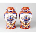 Pair of Asian VasesPair of Asian vases, porcelain , in baluster shape with integrated lids painted