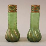 Circle of Johann Loetz manufacture, two glass vases , gilded metal mounts,around 191022cmThis is a