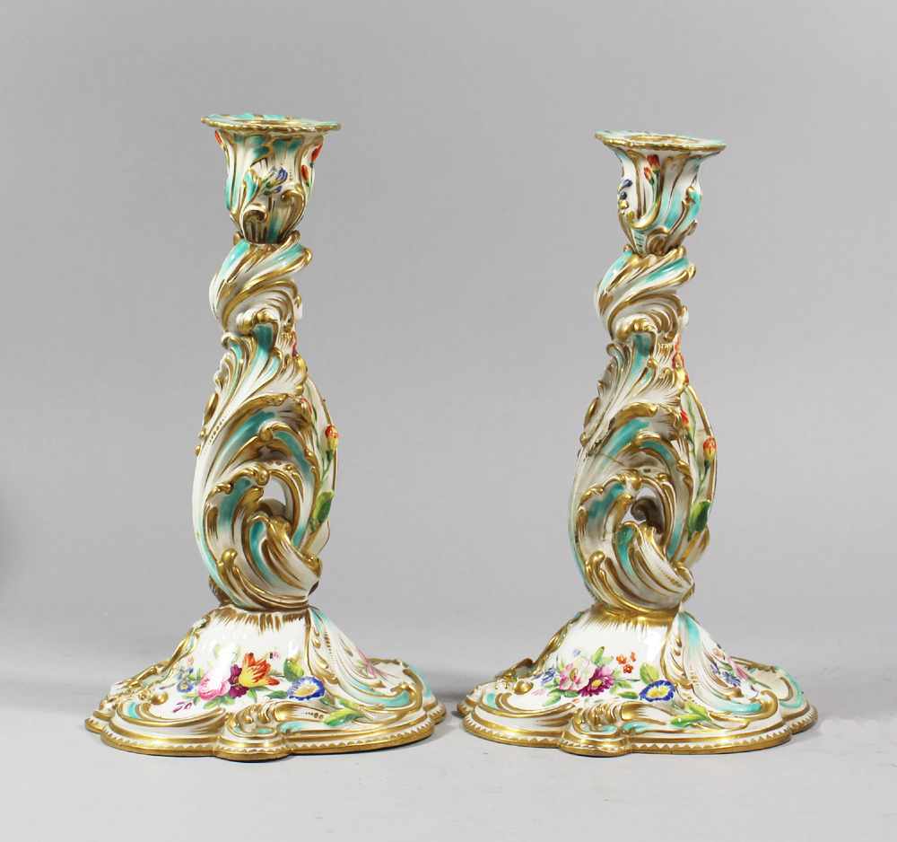 Two Porcelain candlesticks, curved shape, painted, 19. century20cmThis is a timed auction on our