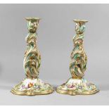 Two Porcelain candlesticks, curved shape, painted, 19. century20cmThis is a timed auction on our