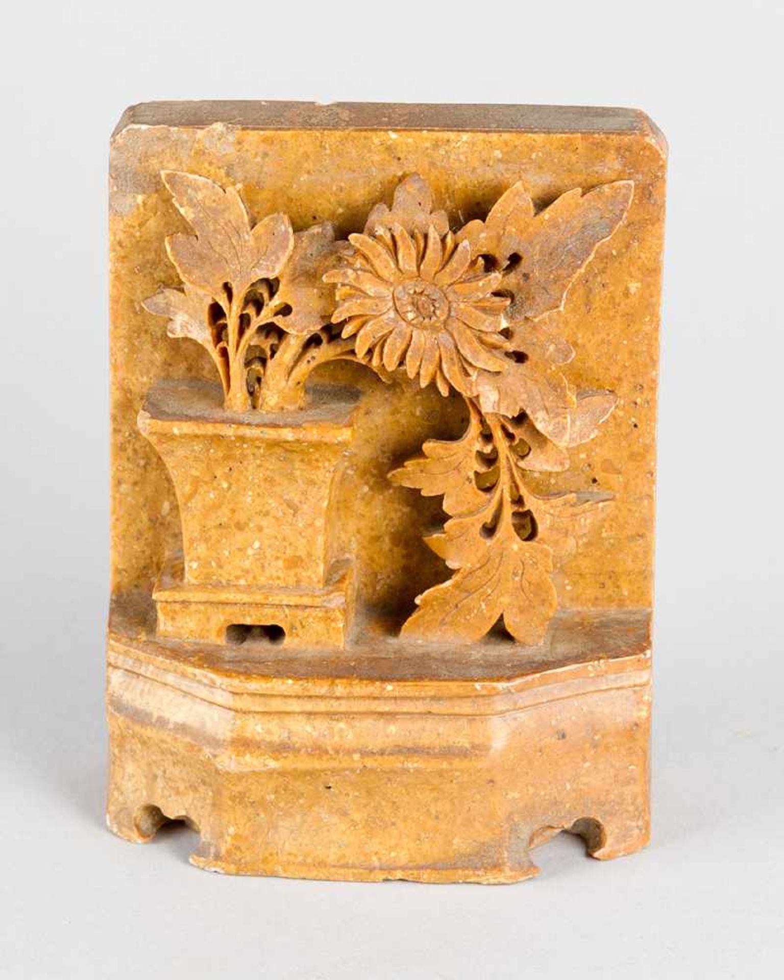 Chinese relief . Vase with flowers on base in half relief technique partly with open work.