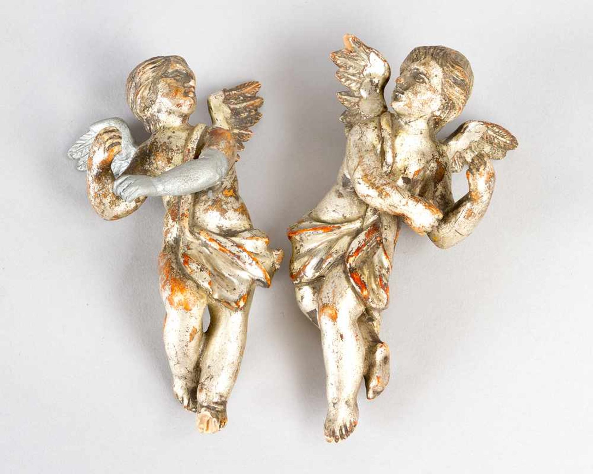 Pair of miniature angels. Wood carved with original silvered colour. One arm and wing attached.