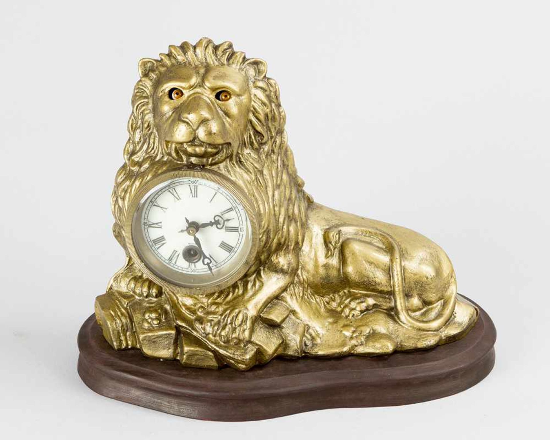 Eye Turning Clock, of a sitting lion, with enamel dial with Roman numbers, two iron fingers, wind up