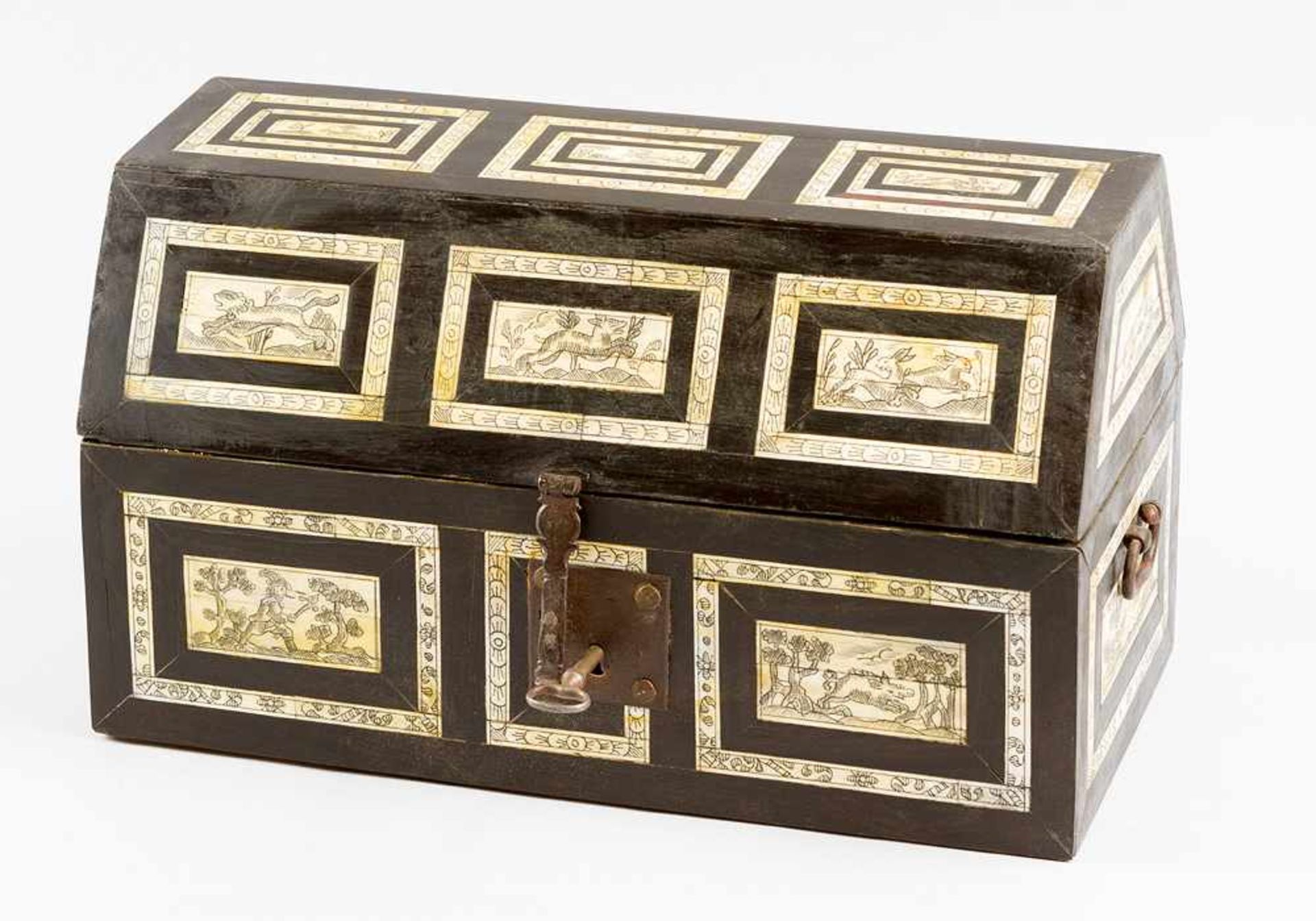 Italian casket, in rectangular shape, with one canted lid; ebonised wood with 19 I. geometrical