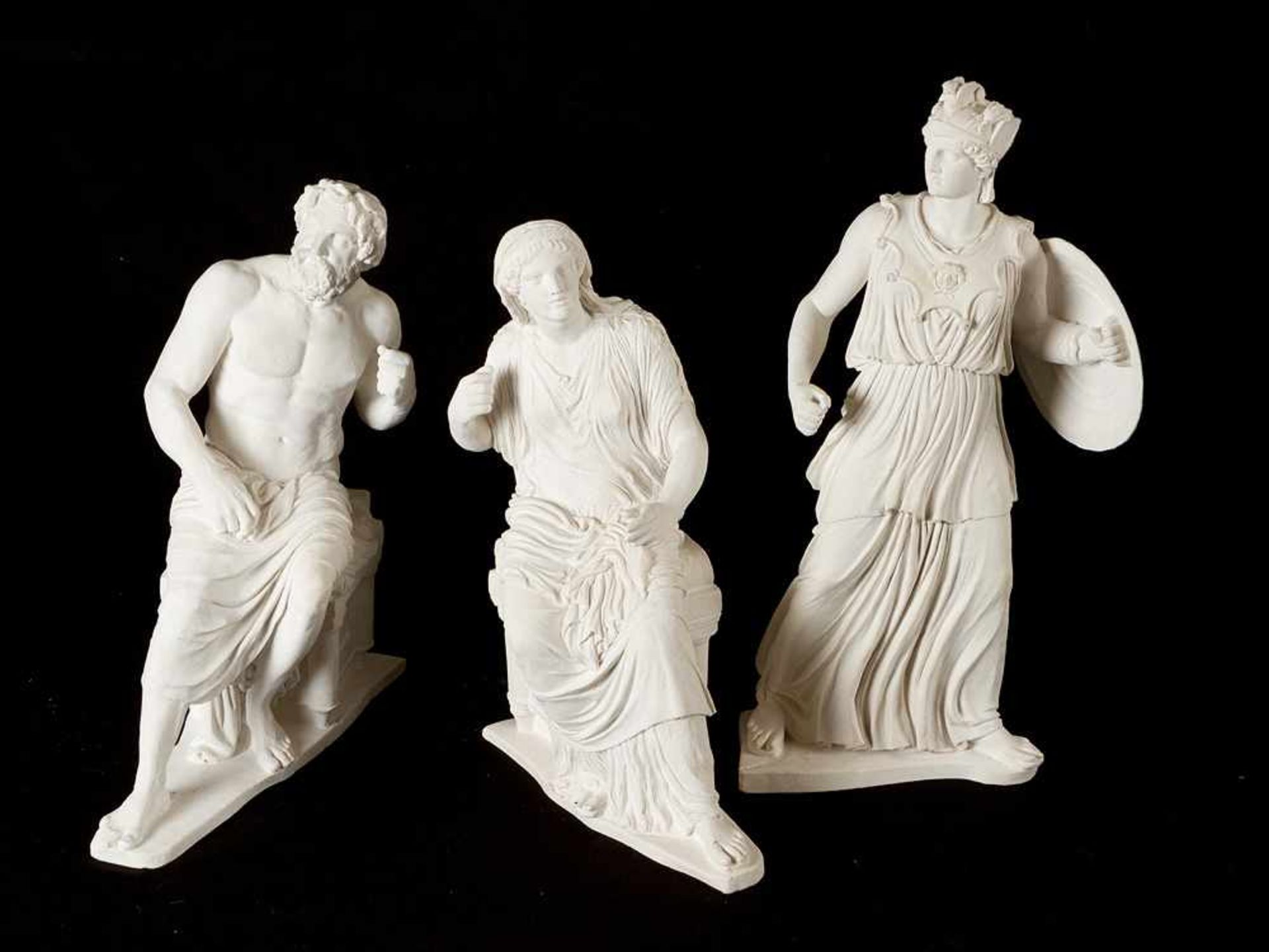 German school 19th Century, Three classical dressed plaster sculptures, in standing and sitting