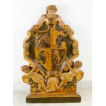 Italian family Coat of Arms, wood carved with two winged angels, fruits and boy’s head on top; in