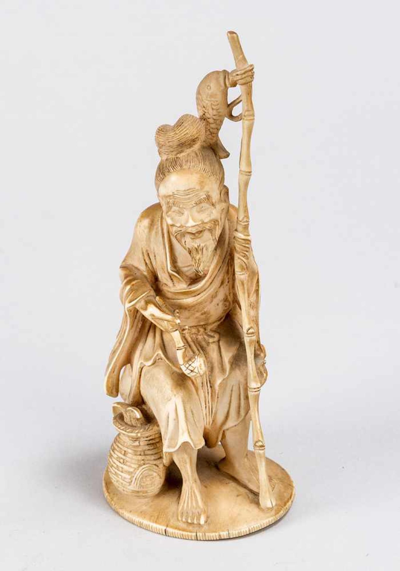 Asian Okimono of an old sitting fisher with pipe and fishing rod, I. Carved, 19th Century.20 cm