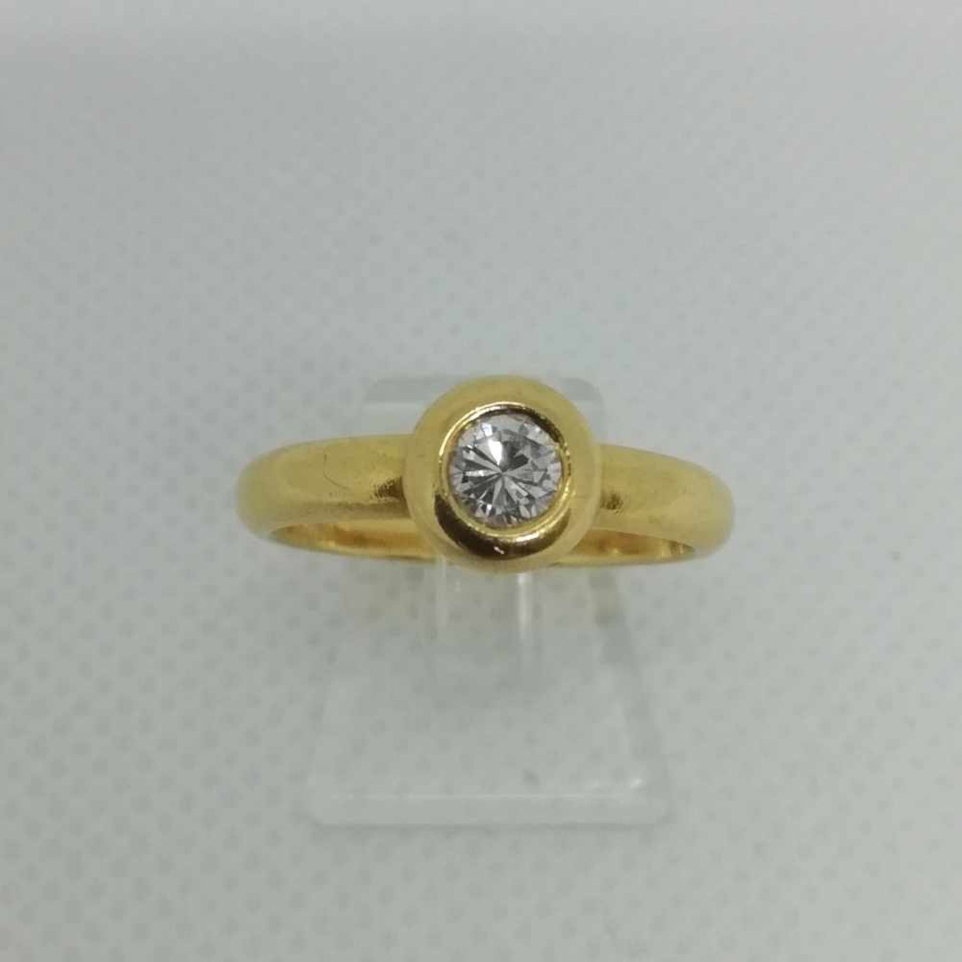 Brillant-Solitär-RingGold 750 mit 1 Brillant ca.0,27 ct, verwischt gefasst, RW 55, 5,2g;