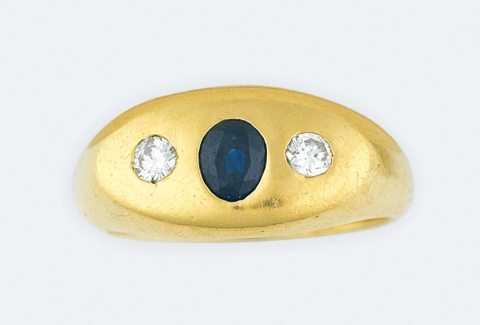 RingGold 750, Brillanten, zus. ca. 0,30ct., mit 1 Saphir, RW 64, 14g;