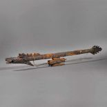 Traditional blowgun made from exotic wood, with a dragon decoration, Indonesia, the beginning of the