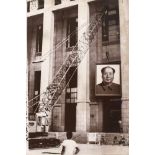 Portrait of Mao Zedong being taken down from a governmental building, Beijing, ca. 1990Portrait of