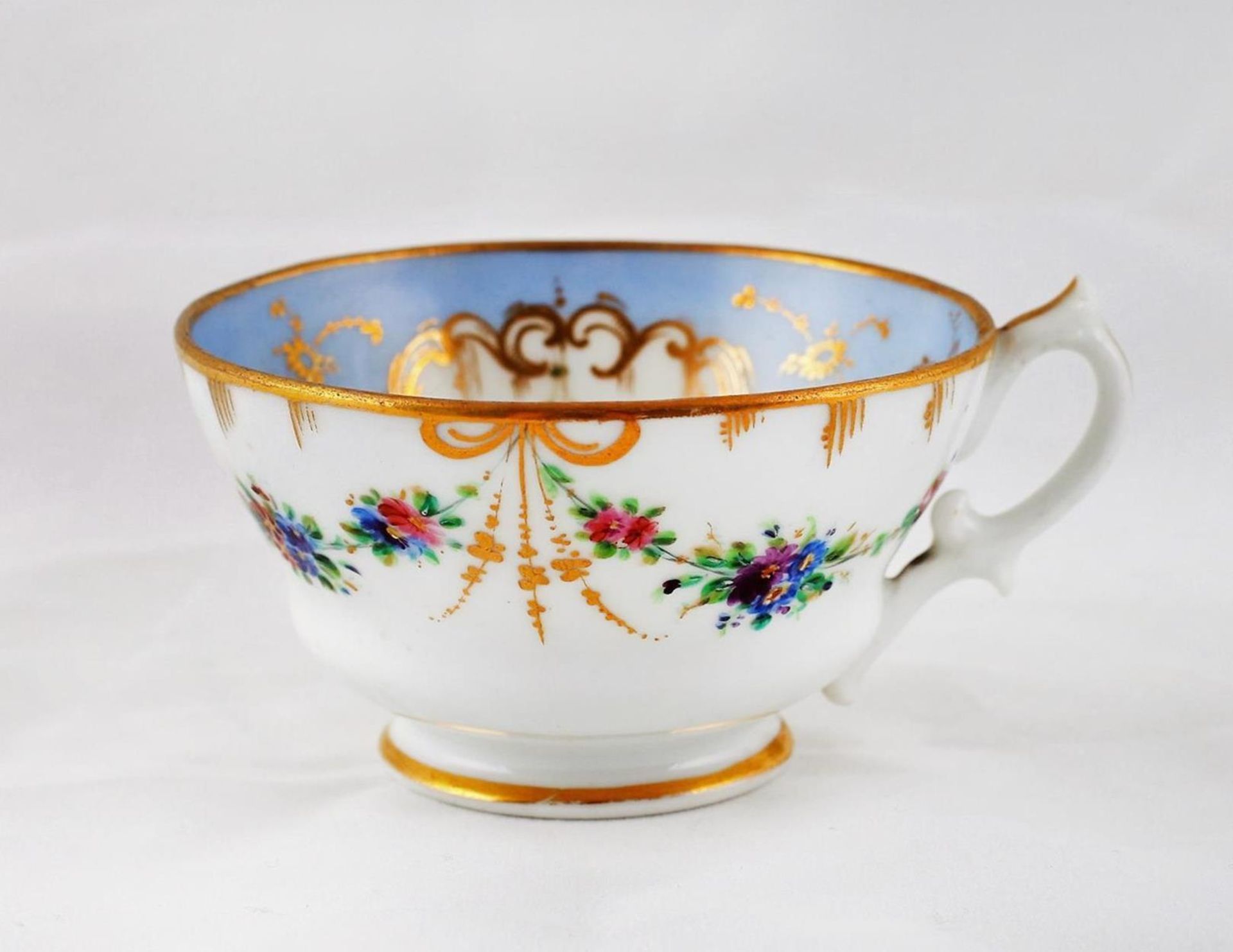 A teacup and a saucer with floral motifs. Porcelain Factory of the Kornilov Brothers. Saint - Image 8 of 11