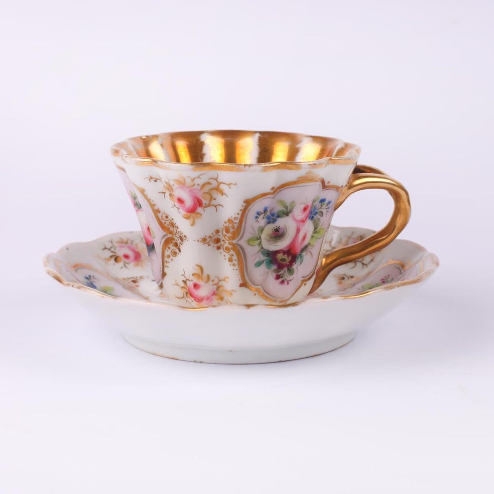 Tea cup and saucer set with flower painting. Kudinov Porceline Factory (?). Russia. 1820s.