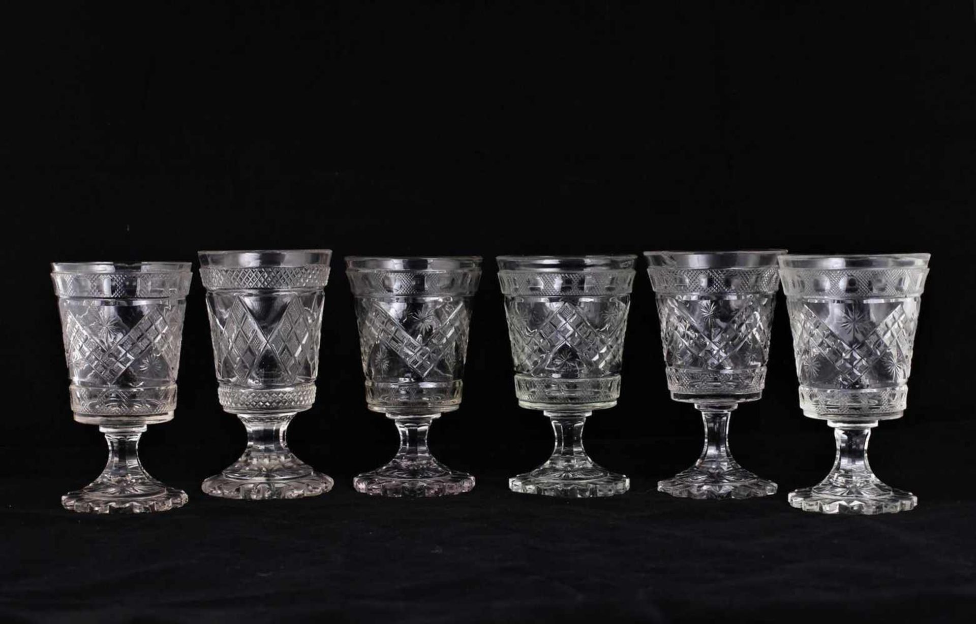 Six wine glasses. [Mid XIX century].Russia. Glass, faceting. Size - 14x7.7 cm.Six wine glasses. [Mid