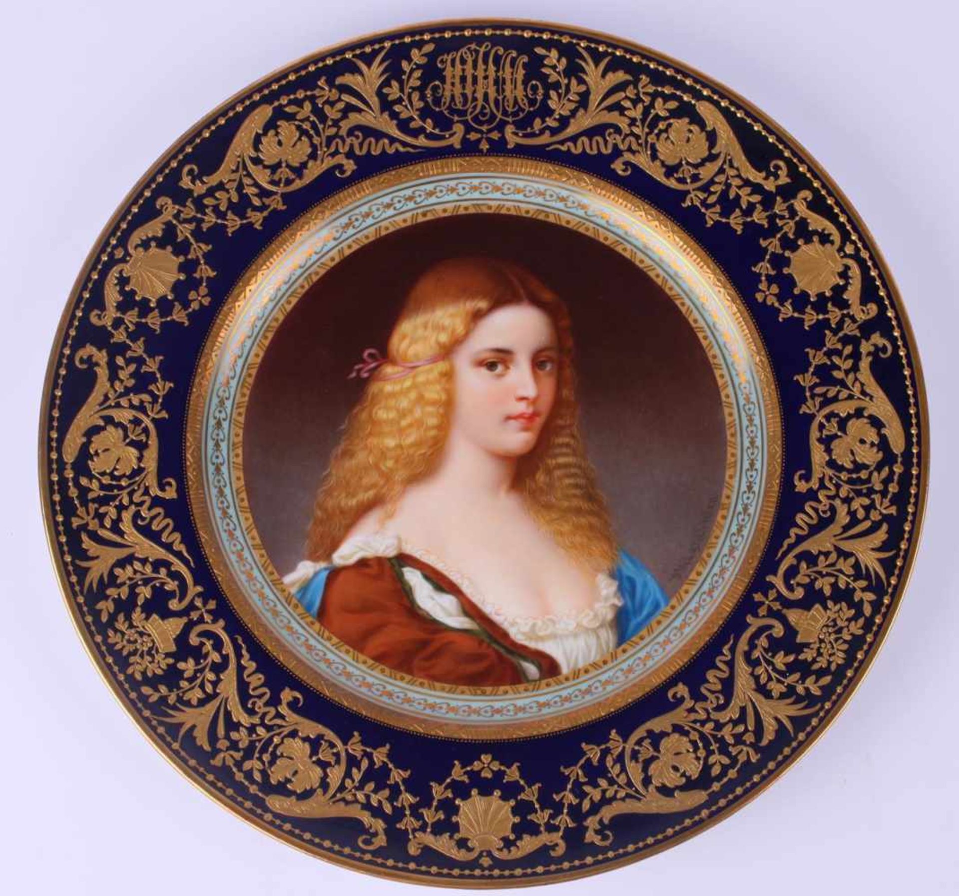 Decorative plate with a female portrait. Pirkenhammer plant.Porcelain gilded cabinet plate with a