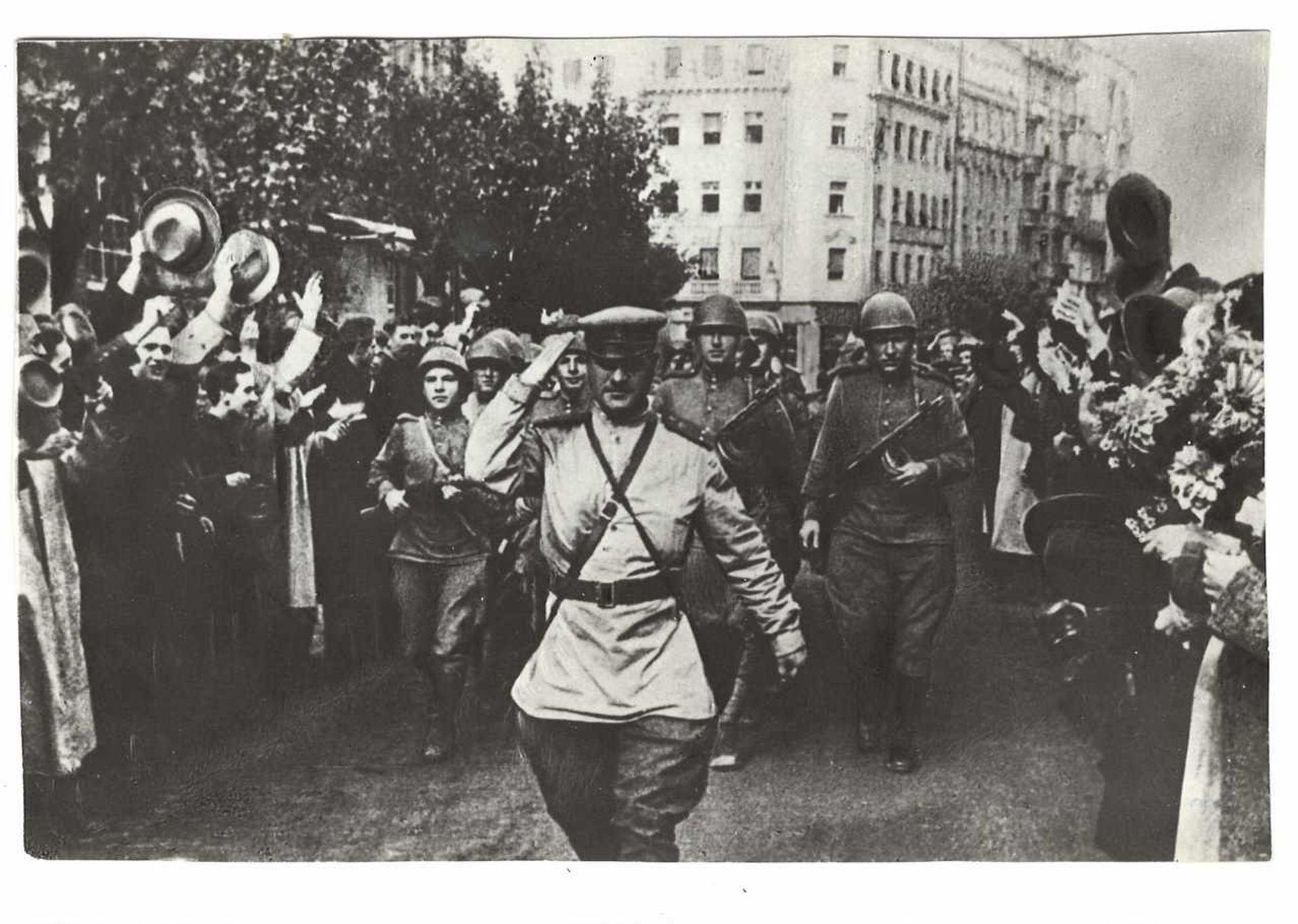 Gelatin Silver Print.Photograph Non-combatant greeting soviet Soviet troops. 1940. Original print.