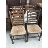 FOUR LADDER BACK OAK DINING CHAIRS WITH RUSH SEATS
