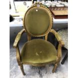 A DECORATIVE GILT FRAMED FRENCH STYLE ARMCHAIR WITH GREEN UPHOLSTERED BACK AND SEAT