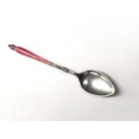 A CONTINENTAL SILVER AND PINK ENAMEL TEASPOON