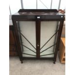 AN ART DECO STYLE MAHOGANY CHINA CABINET ON CABRIOLE SUPPORTS WITH TWO DOORS