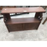 A MAHOGANY BUFFET SERVER WITH TWO DOORS AND FRETWORK SIDES