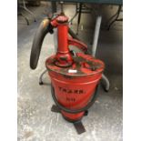 A 1950'S RED METAL GREASE / OIL PUMP