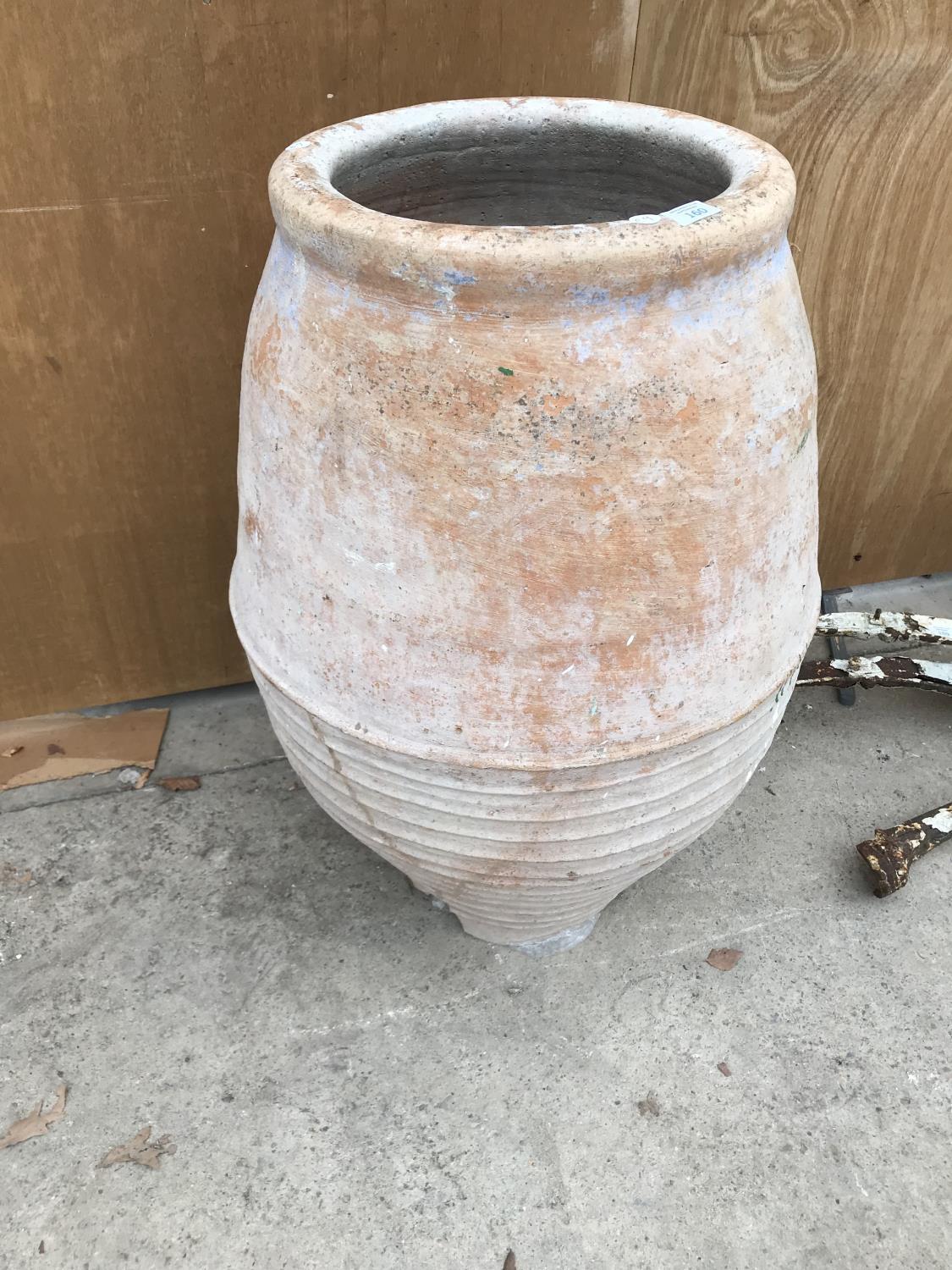 A LARGE TERRACOTTA URN 83CM HIGH (A/F AT BASE)