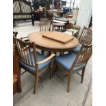 A STAG EXTENDING MAHOGANY DINING TABLE AND FOUR DINING CHAIRS