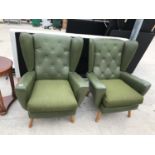 TWO RETRO GREEN LEATHERETTE WING BACK ARMCHAIRS