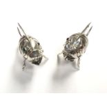 A PAIR OF SILVER UNUSUAL FISH DESIGN CRUETS WITH SCREW UNDERSIDE FINS AND COLOURED EYES, HEIGHT 4.