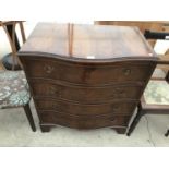 A SERPENTINE FRONT MAHOGANY CHEST OF FOUR DRAWERS