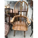 AN OAK WINDSOR ARMCHAIR