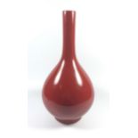 A CHINESE FLAMBE SANG DE BOUEF BOTTLE FORM VASE, SIGNED QIANLONG MARK TO BASE, HEIGHT 26.5CM