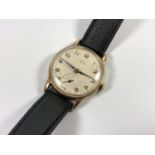 A 9CT GOLD CASED 'SMITHS' DE LUXE BRITISH RAILWAYS PRESENTATION WATCH, WORKING