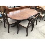 AN EXTENDING MAHOGANY DINING TABLE AND FOUR CHAIRS