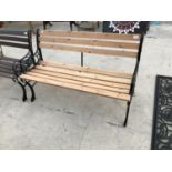 A WOODEN BENCH WITH CAST IRON ENDS 119CM LONG