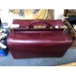 A RED LEATHER DOCTORS CARRY BAG