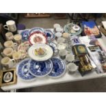 A LARGE COLLECTION OF ASSORTED COMMEMORATIVE WARE ITEMS TO INCLUDE PLATES, MUGS, BOOKS ETC (QTY)