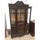 AN INLAID MAHOGANY CABINET WITH GLAZED CENTRE PANEL AND TWO GLAZED SIDE DOORS