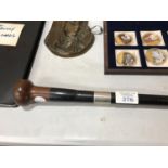 A VINTAGE WALKING STICK WITH AN UNMARKED, PROBABLY SILVER, FERRULE