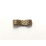 AN UNMARKED YELLOW METAL 'BRACELET' RING, WEIGHT 3.7G