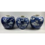 A GROUP OF THREE CHINESE 'PRUNUS' PATTERN BLUE AND WHITE GINGER JARS, TWO WITH FOUR CHARACTER MARK